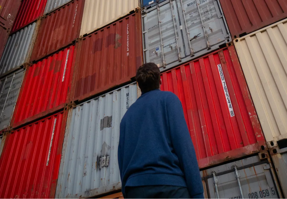 Photo of person standing in front of cargo